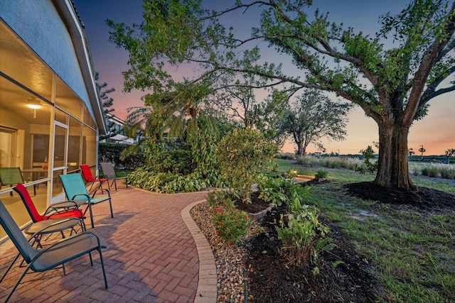 view of patio terrace at dusk