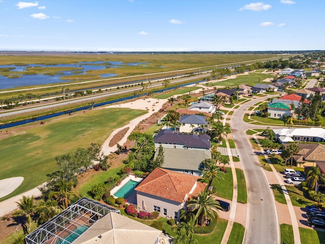 bird's eye view featuring a residential view, a water view, and golf course view