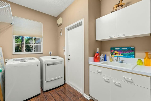 2476 NW 67th St, Boca Raton, FL 33496 - washroom featuring independent washer and dryer, dark wood-type flooring, a sink, and cabinet space