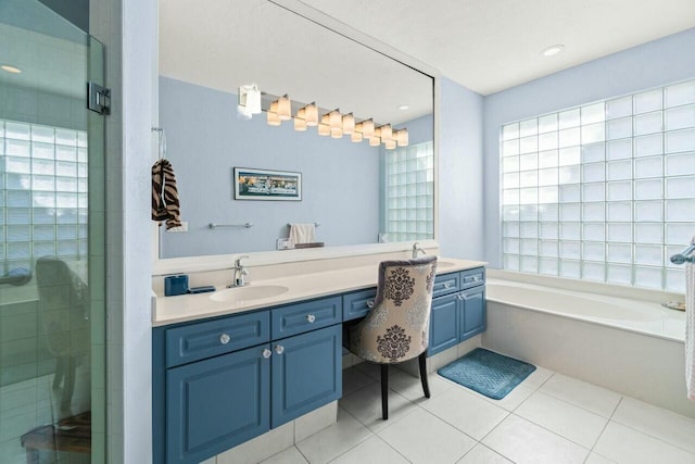 2476 NW 67th St, Boca Raton, FL 33496 - bathroom with tile patterned floors, vanity, a garden tub, and a stall shower