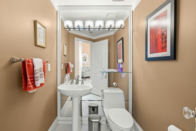 2476 NW 67th St, Boca Raton, FL 33496 - bathroom with toilet and baseboards