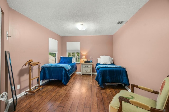 2476 NW 67th St, Boca Raton, FL 33496 - bedroom with a textured ceiling, hardwood / wood-style floors, baseboards, and visible vents