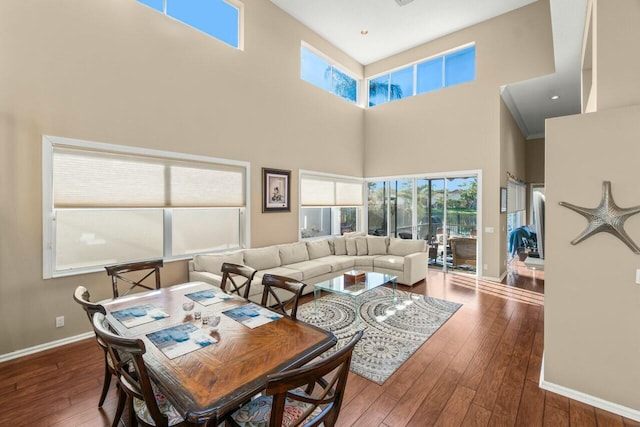 2476 NW 67th St, Boca Raton, FL 33496 - living room with wood-type flooring, a wealth of natural light, a high ceiling, and baseboards