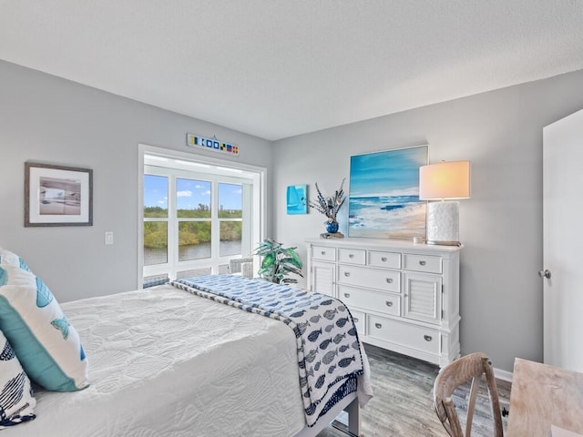 2800 Indian River Blvd Unit F8, Vero Beach, FL 32960 - bedroom featuring wood finished floors and a water view