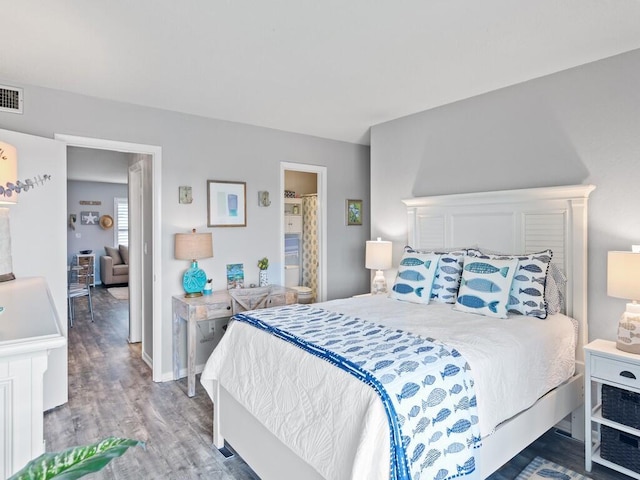 2800 Indian River Blvd Unit F8, Vero Beach, FL 32960 - bedroom with wood finished floors and ensuite bath