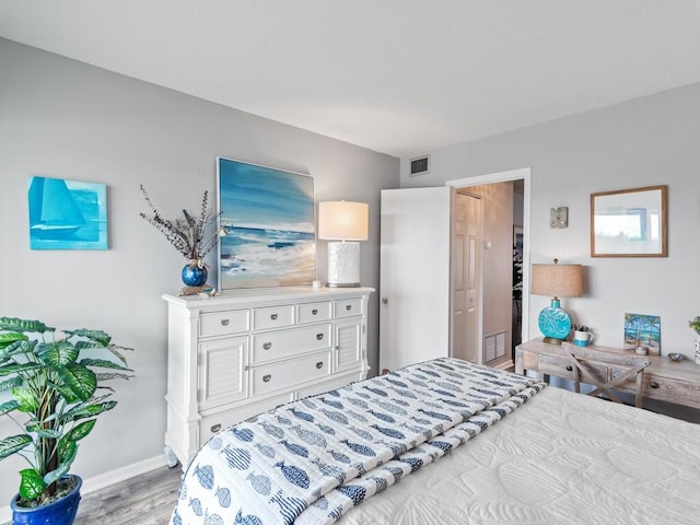 2800 Indian River Blvd Unit F8, Vero Beach, FL 32960 - bedroom with light wood finished floors and baseboards