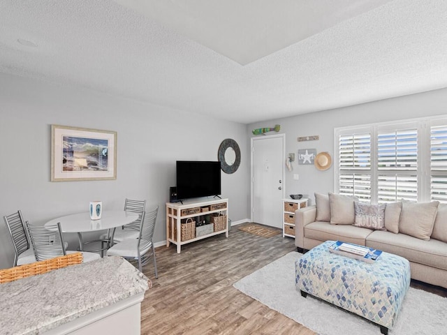 2800 Indian River Blvd Unit F8, Vero Beach, FL 32960 - living area with wood finished floors and a textured ceiling