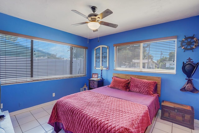tiled bedroom with a ceiling fan