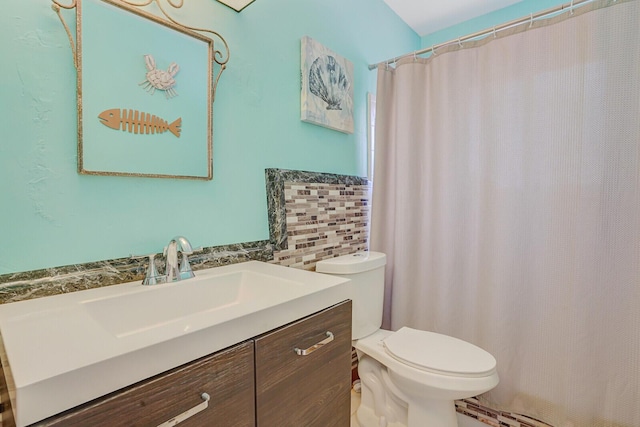 bathroom with vanity, toilet, and curtained shower