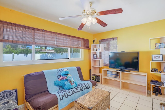 living room with ceiling fan and tile patterned flooring