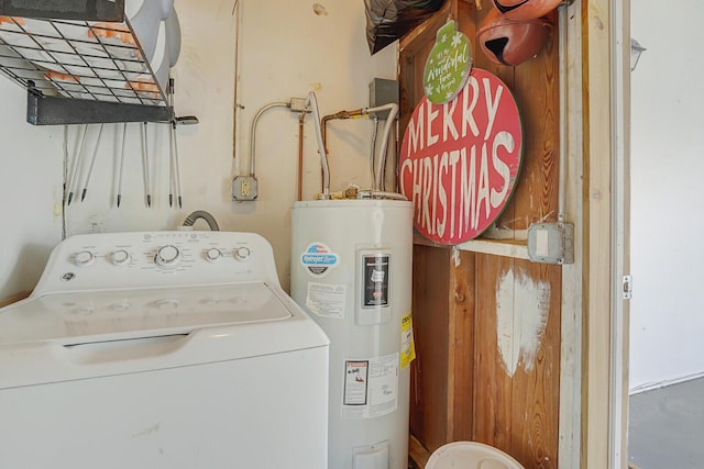 clothes washing area featuring washer / dryer, laundry area, and electric water heater