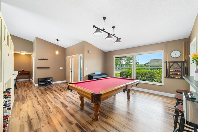 playroom featuring pool table, baseboards, vaulted ceiling, and light wood finished floors