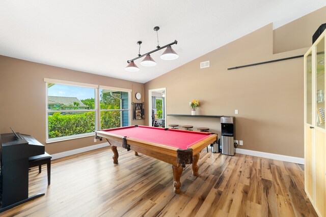 recreation room with billiards, visible vents, vaulted ceiling, baseboards, and light wood-style floors