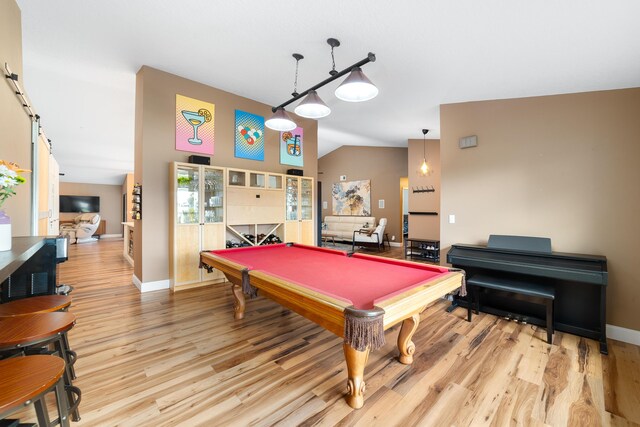 game room featuring wood finished floors, billiards, baseboards, and lofted ceiling
