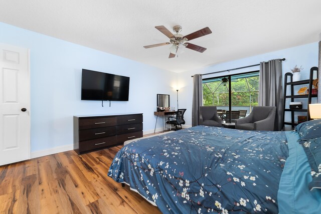 bedroom featuring baseboards, ceiling fan, and wood finished floors