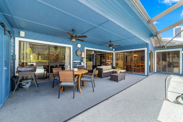 view of patio with outdoor dining space, ceiling fan, and an outdoor living space