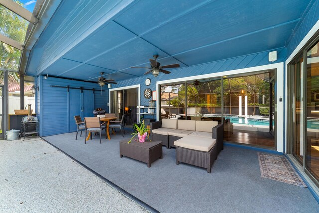 view of patio featuring outdoor dining space, ceiling fan, outdoor lounge area, a fenced in pool, and a lanai