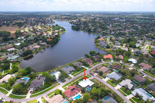 birds eye view of property featuring a residential view and a water view