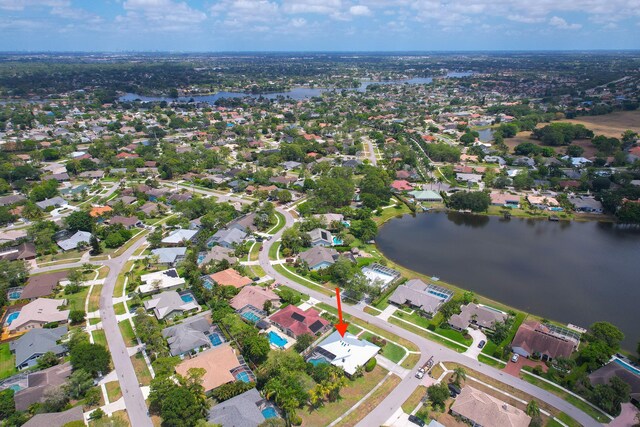 aerial view featuring a water view and a residential view