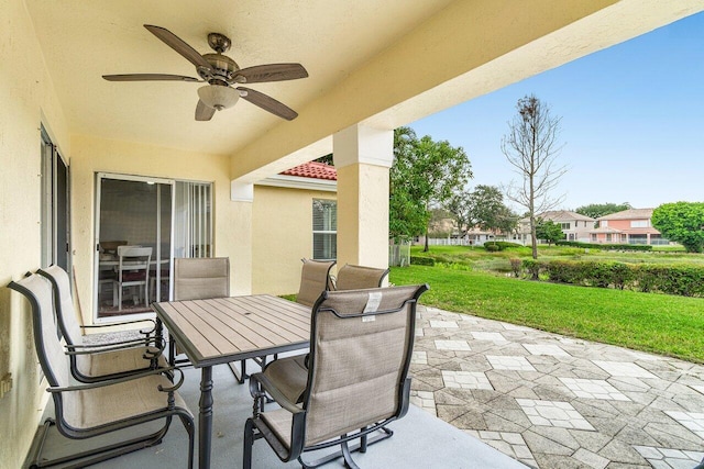 view of patio / terrace with outdoor dining space and ceiling fan