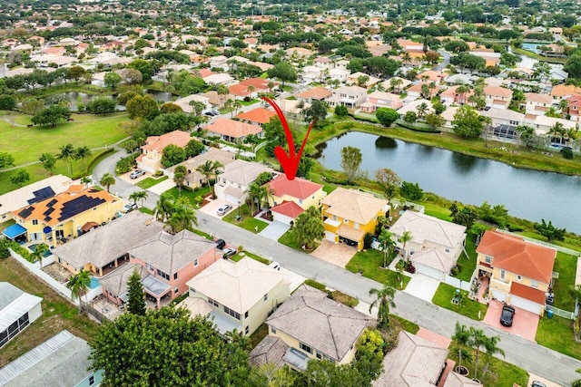 bird's eye view with a water view and a residential view