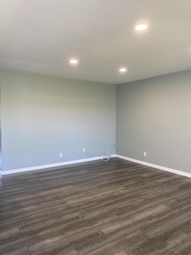 563 Capri L, Delray Beach, FL 33484 - unfurnished room with recessed lighting and dark wood-style flooring