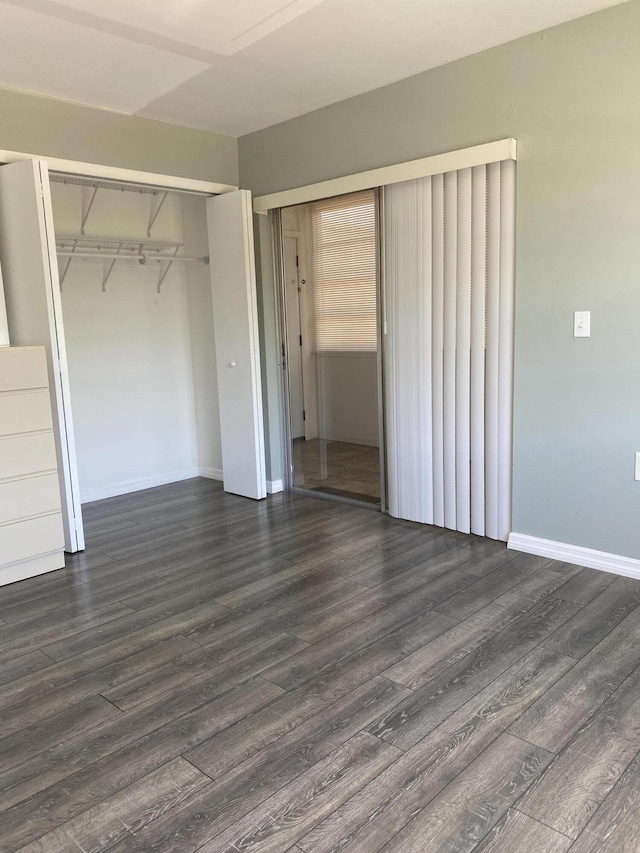 563 Capri L, Delray Beach, FL 33484 - unfurnished bedroom featuring dark wood-style floors and a closet