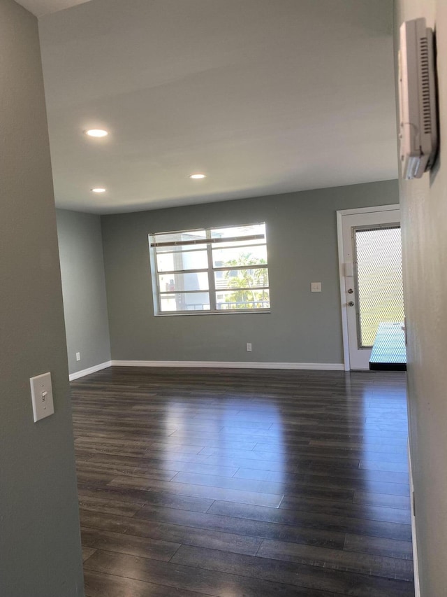 563 Capri L, Delray Beach, FL 33484 - unfurnished room with dark wood finished floors and recessed lighting