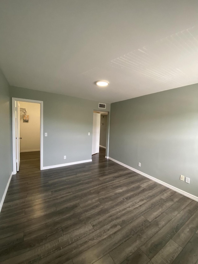 563 Capri L, Delray Beach, FL 33484 - empty room with dark wood-style flooring