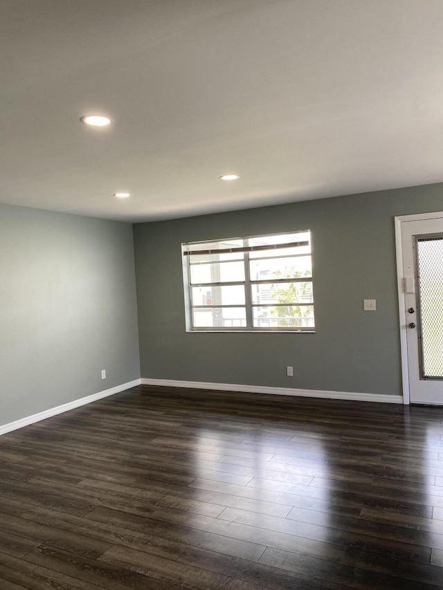 563 Capri L, Delray Beach, FL 33484 - spare room with dark wood-style flooring and recessed lighting