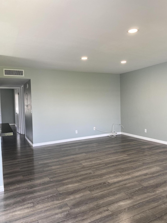 563 Capri L, Delray Beach, FL 33484 - spare room with dark wood-style flooring and recessed lighting