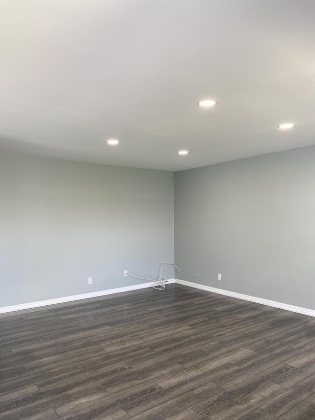 563 Capri L, Delray Beach, FL 33484 - empty room with dark wood-style flooring and recessed lighting