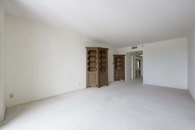 529 S Flagler Dr Unit 25F, West Palm Beach, FL 33401 - unfurnished room with visible vents, light colored carpet, and lofted ceiling
