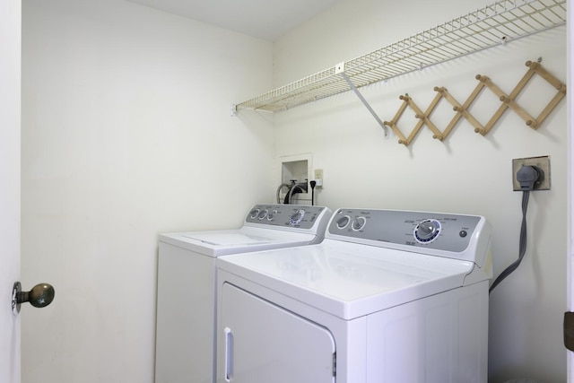 529 S Flagler Dr Unit 25F, West Palm Beach, FL 33401 - washroom with washer and clothes dryer and laundry area