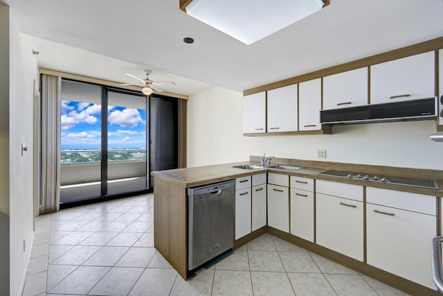 529 S Flagler Dr Unit 25F, West Palm Beach, FL 33401 - kitchen with a peninsula, white cabinetry, dishwasher, a sink, and black electric cooktop