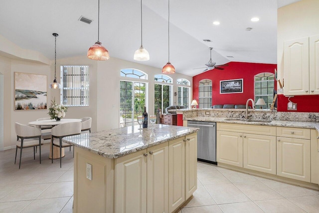kitchen featuring a ceiling fan, a sink, dishwasher, lofted ceiling, and visible vents