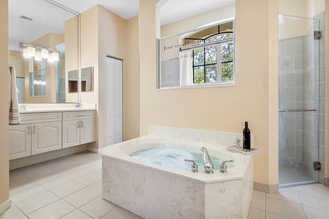 bathroom featuring a bath, tile patterned floors, visible vents, a shower stall, and vanity