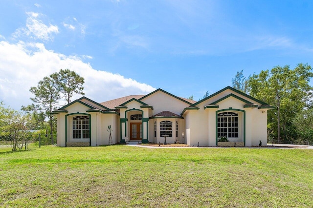 single story home with fence, french doors, a front yard, and stucco siding