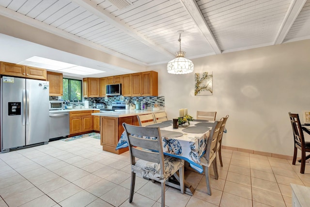 dining space featuring light tile patterned floors, baseboards, beam ceiling, and a notable chandelier