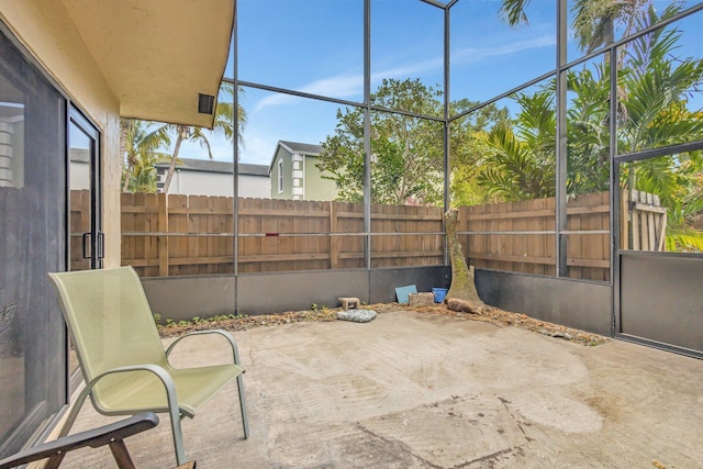 view of patio / terrace with a fenced backyard and a lanai