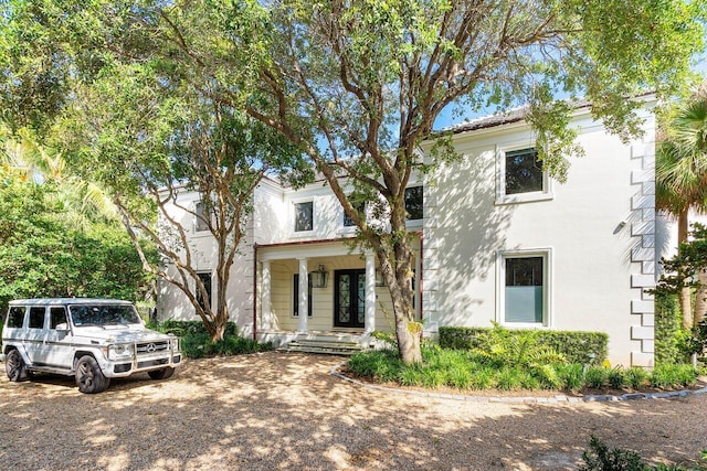 5 Osprey Ct, Ocean Ridge, FL 33435 - view of front facade featuring a porch and stucco siding