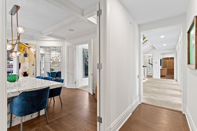 5 Osprey Ct, Ocean Ridge, FL 33435 - corridor featuring baseboards, coffered ceiling, beamed ceiling, crown molding, and a chandelier