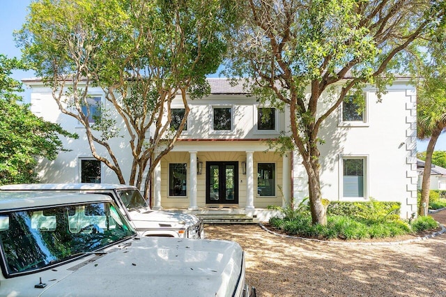 5 Osprey Ct, Ocean Ridge, FL 33435 - view of front facade featuring a porch and french doors