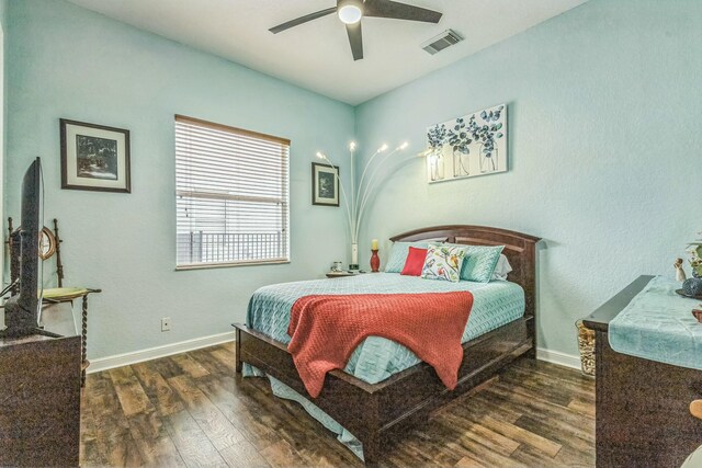 694 Cresta Cir, West Palm Beach, FL 33413 - bedroom with ceiling fan, baseboards, wood finished floors, and visible vents