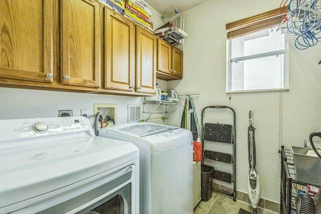 694 Cresta Cir, West Palm Beach, FL 33413 - laundry room with cabinet space and independent washer and dryer