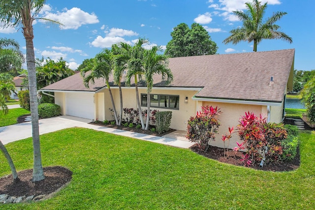 6125 Winding Brook Way, Delray Beach, FL 33484 - view of front of property with stucco siding, a front lawn, concrete driveway, an attached garage, and a shingled roof