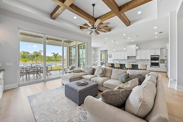 living room with recessed lighting, ceiling fan, baseboards, and coffered ceiling