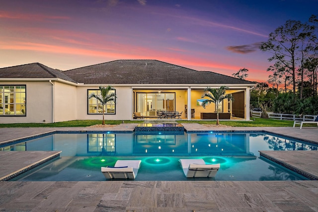 outdoor pool with an outdoor living space, a patio area, ceiling fan, and fence