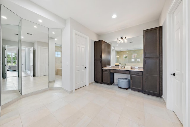 full bath featuring tile patterned floors, baseboards, recessed lighting, and vanity