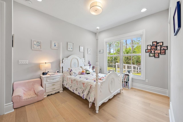 bedroom featuring recessed lighting, light wood-style floors, and baseboards
